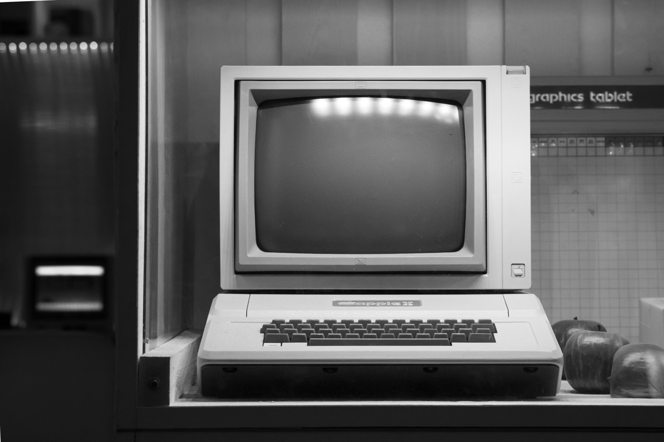 Black and white image of a classic Apple II computer on display in Wrocław, Poland.